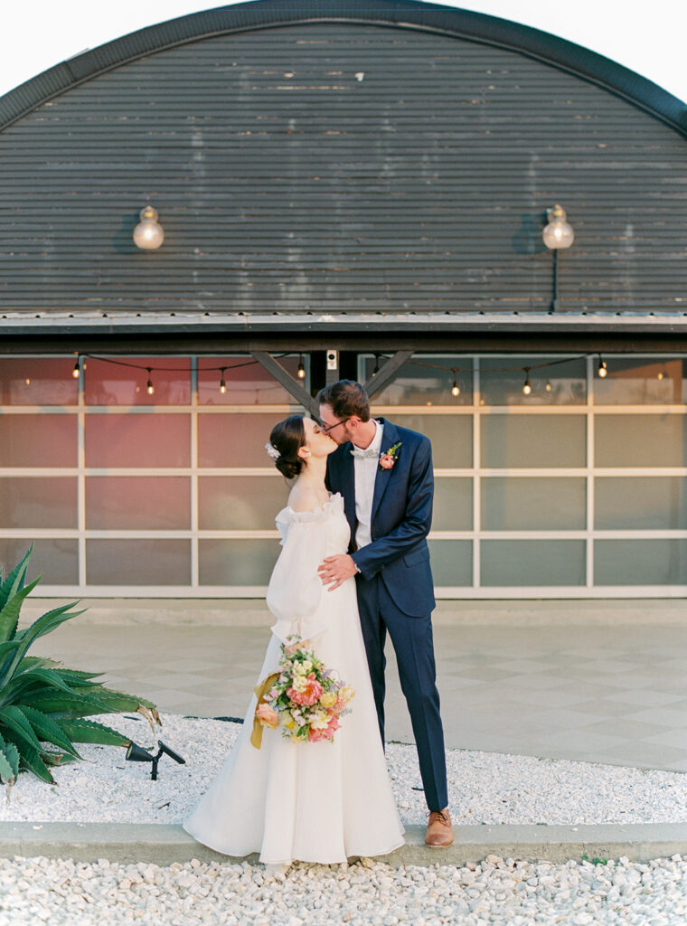 Couple at greenhouse wedding venue with natural editing