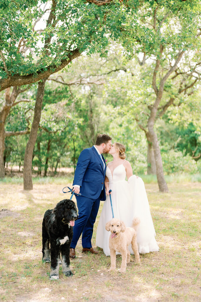 Bride and groom with their dogs at The Grand Lady