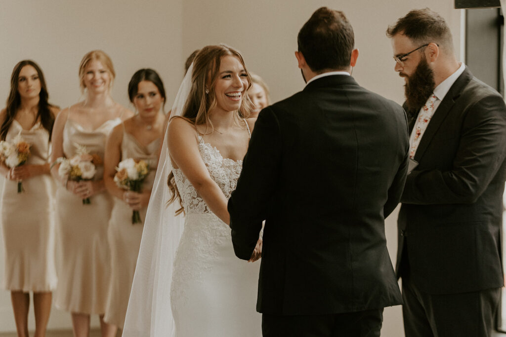 bride smiling during romantic wedding ceremony