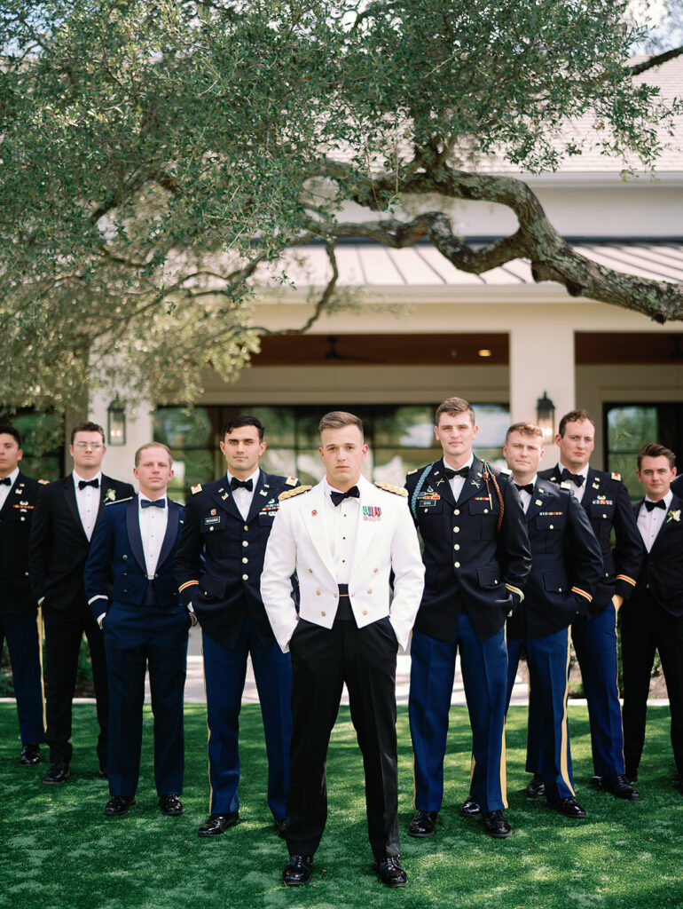 Army lieutenant with military groomsmen on wedding day. Groomsmen wearing army and air force uniforms