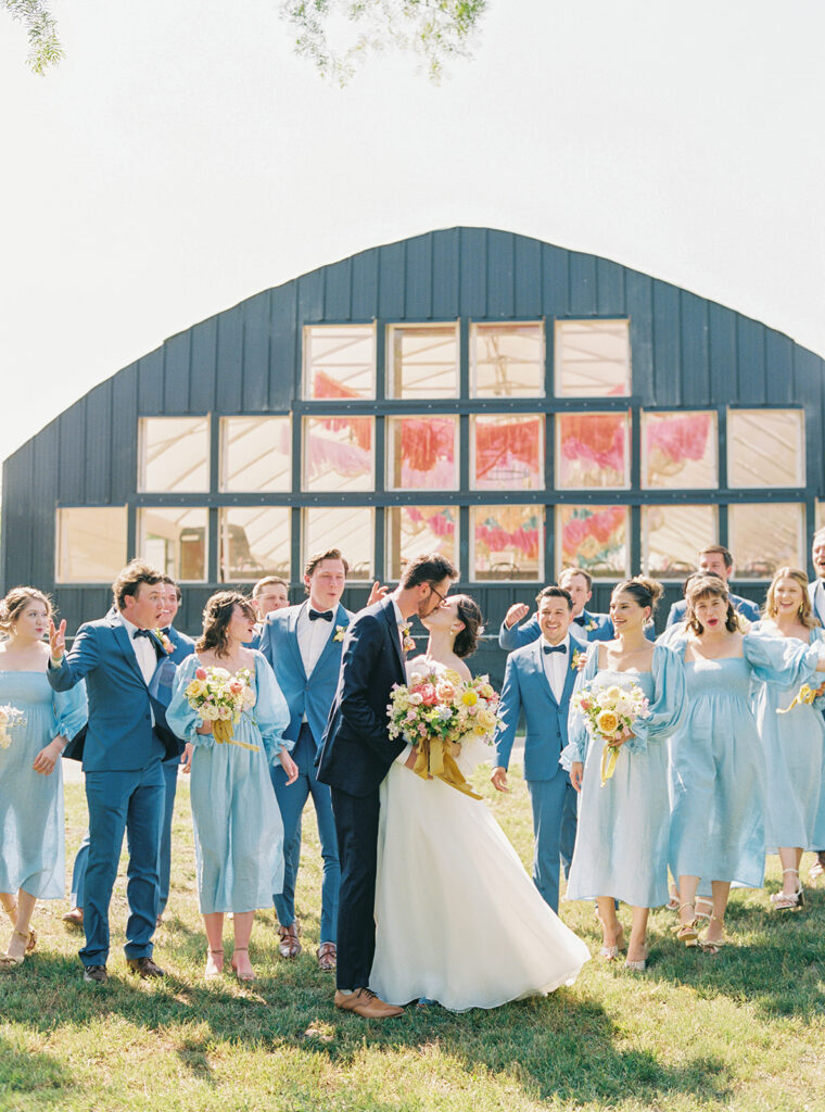 wedding party in front of greenhouse wedding venue
