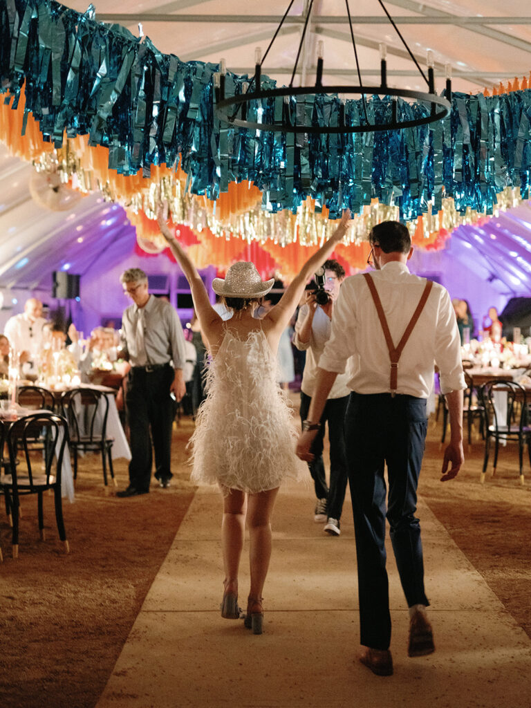bride dancing into greenhouse wedding reception