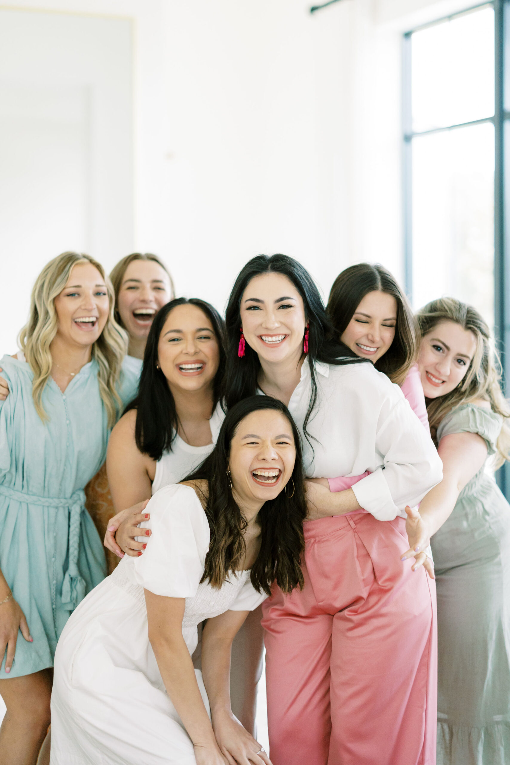Team of austin wedding planners laughing together