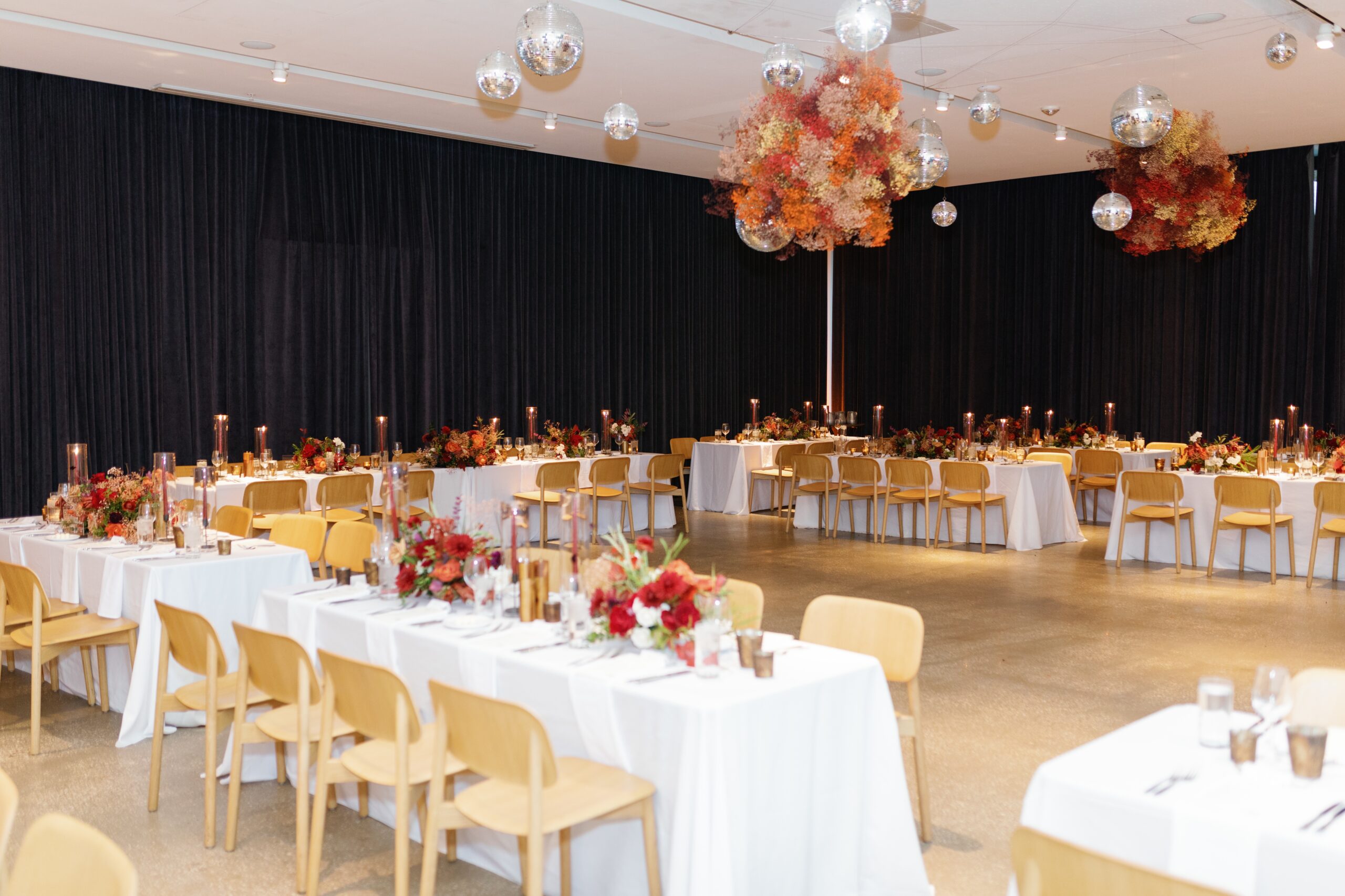modern jewel tone wedding flowers with disco ball ceiling