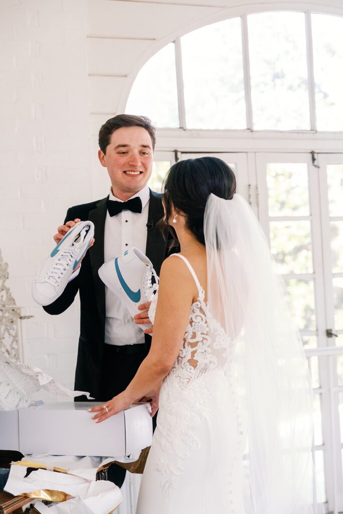 Groom exchanges gift with bride