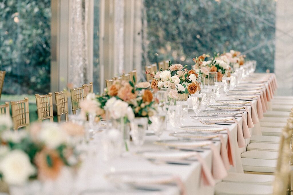 winter wedding head table at woodbine mansion with warm neutral flowers