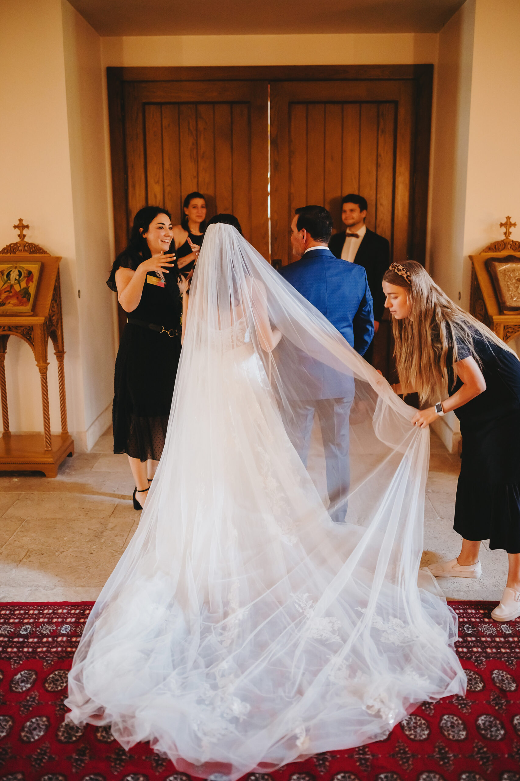 austin wedding planner adjusting bride's veil