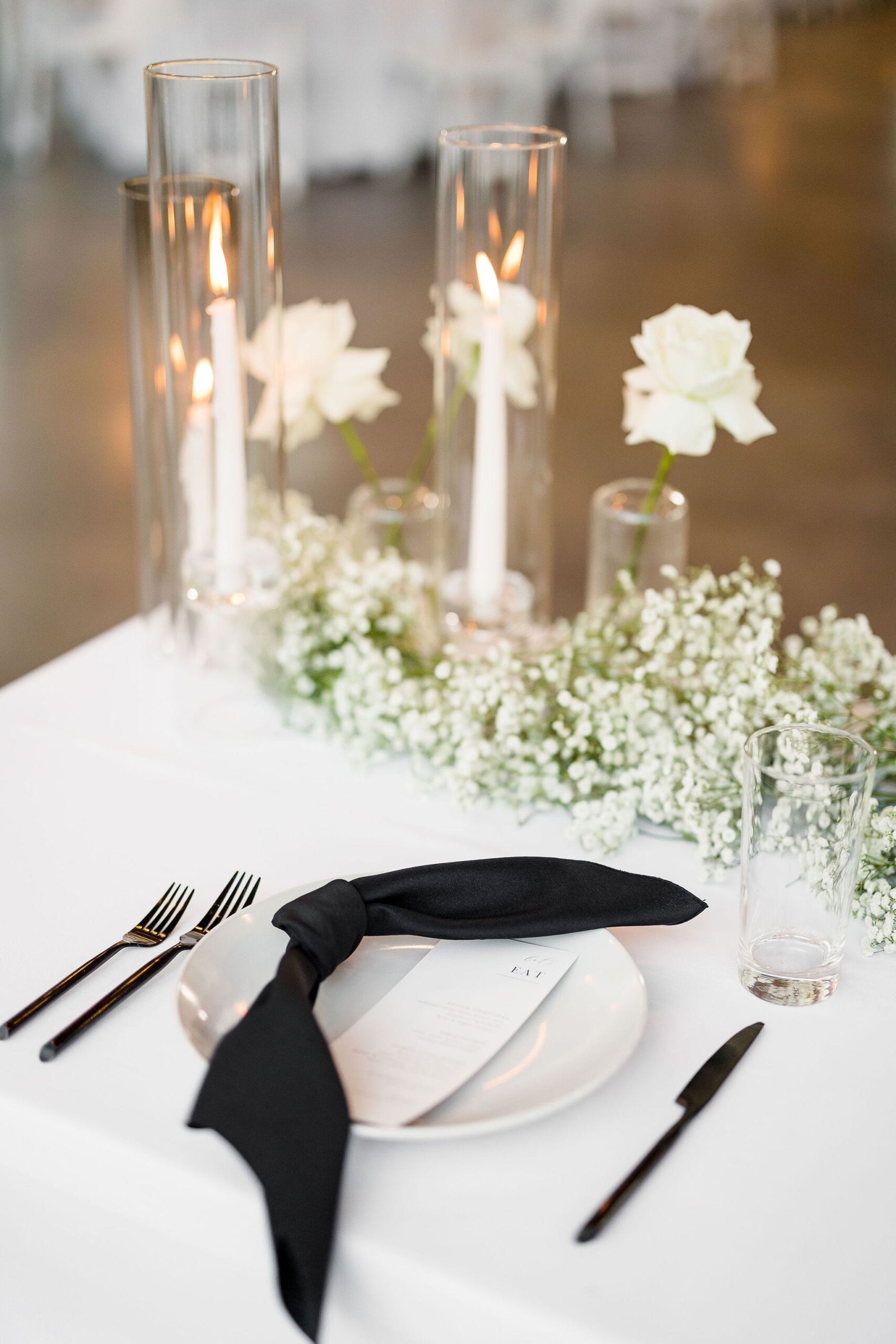 white modern wedding flowers with black accents