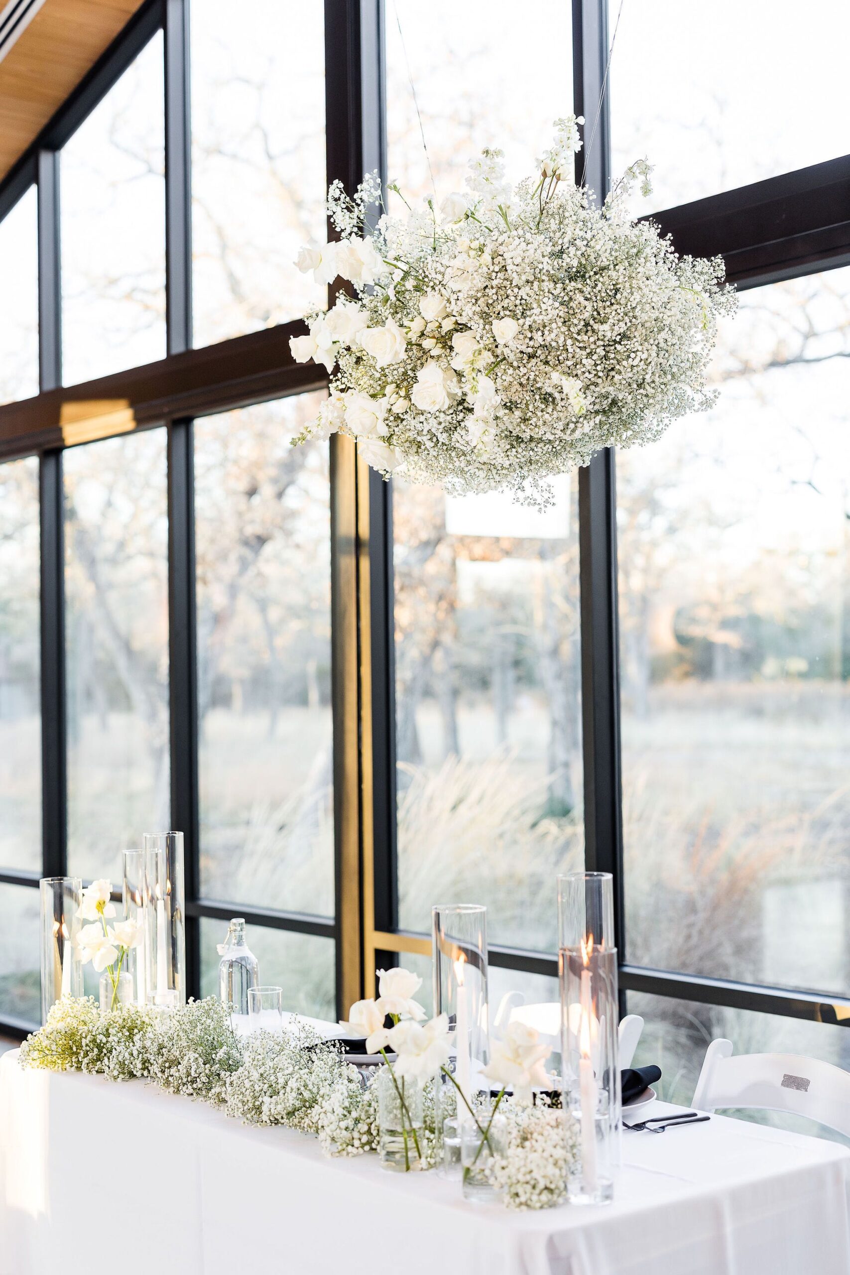 modern white wedding flowers on sweetheart table