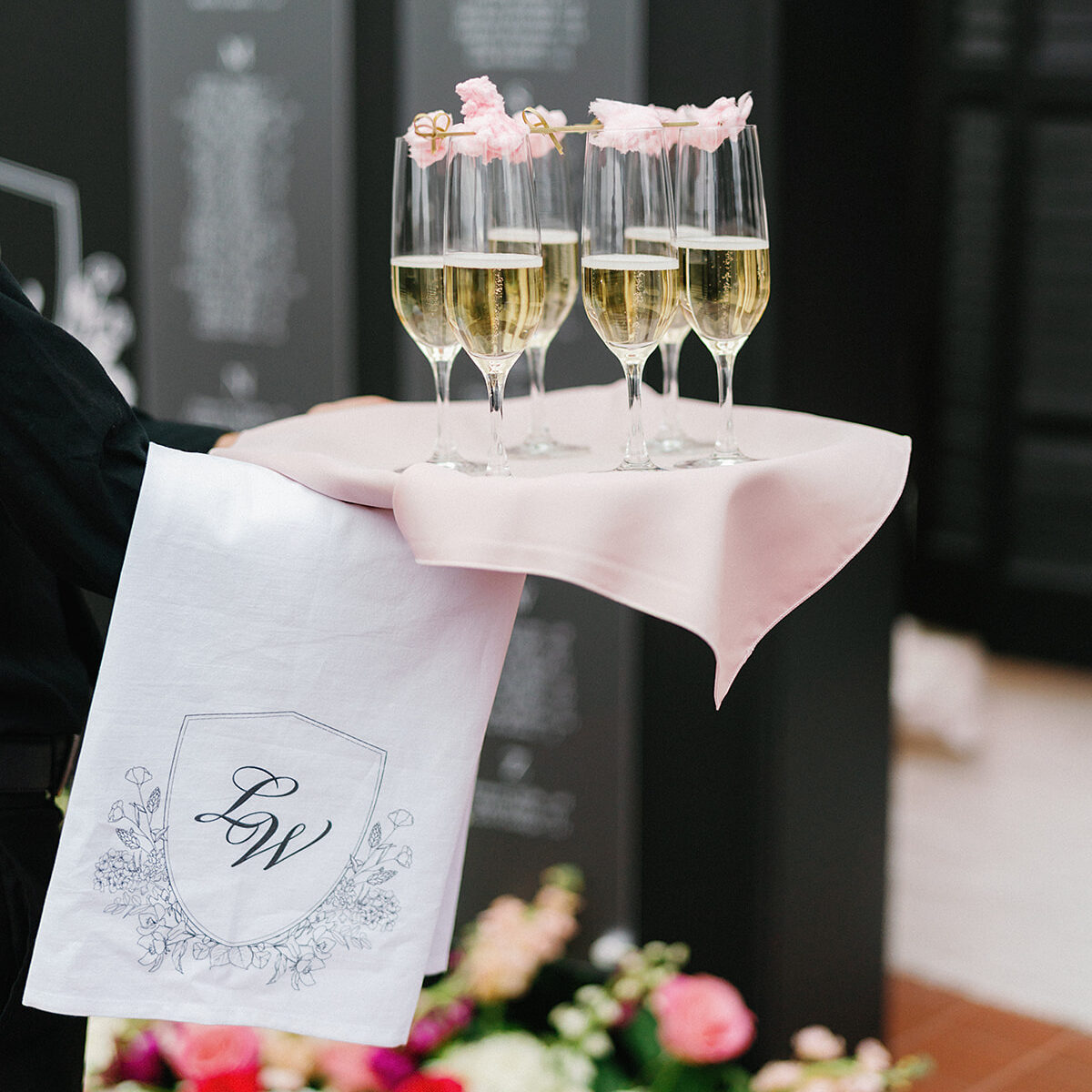 Cotton candy topped champagne with custom butler towels