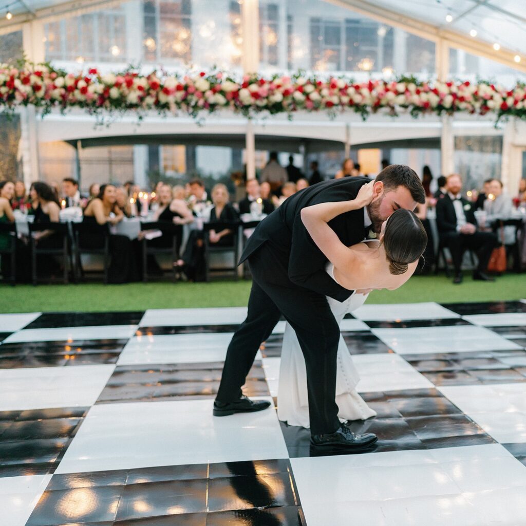 Bride and groom dip during fist dance