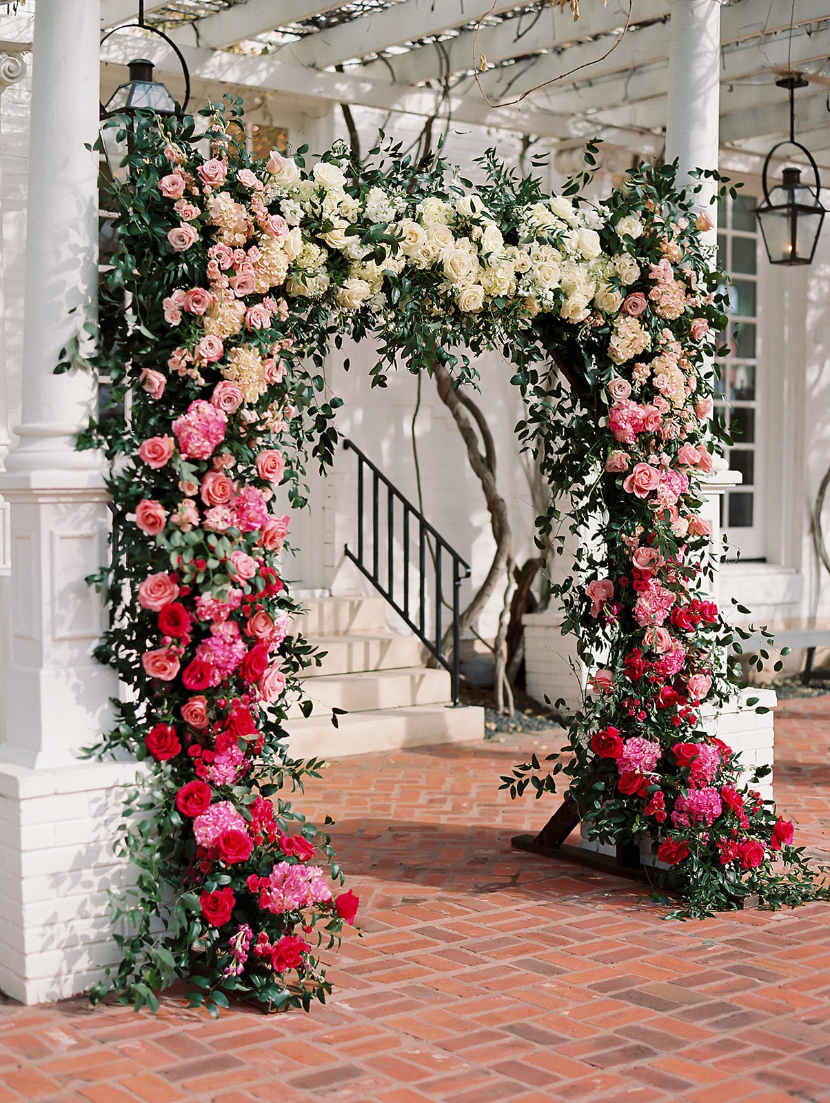 Ombre pink wedding ceremony arch