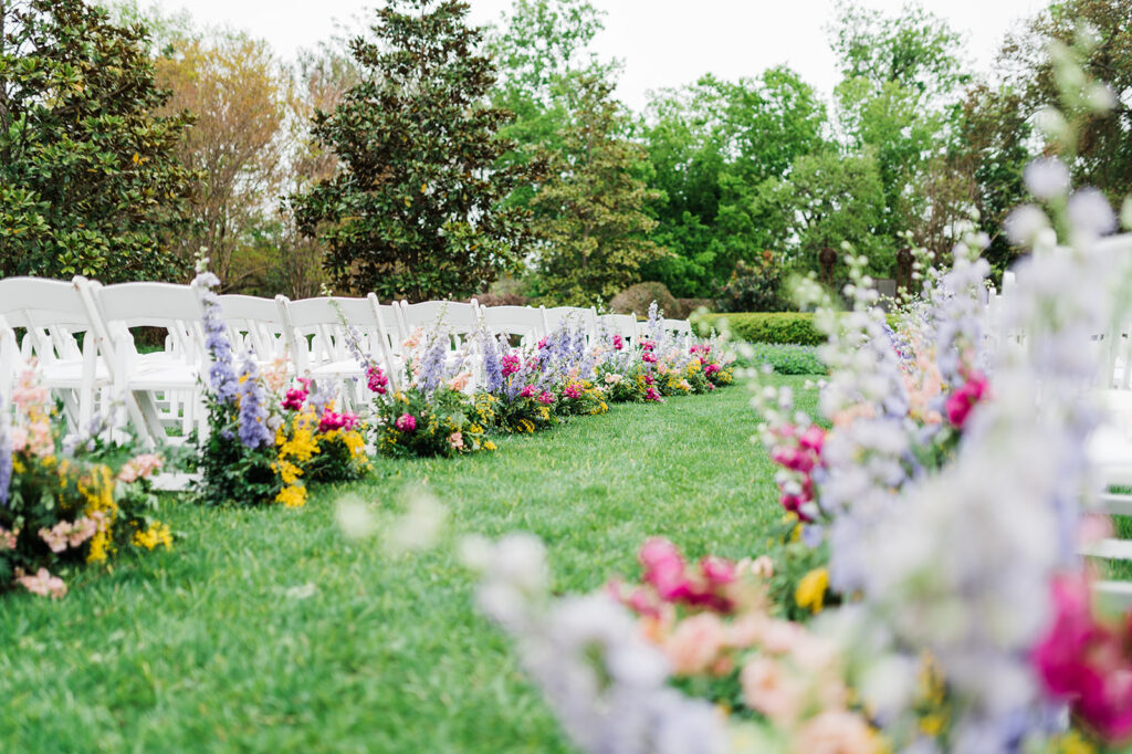 Colorful wedding aisle flowers