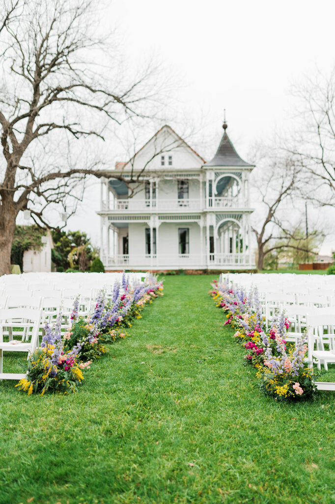 Colorful wedding aisle flowers at Barr Mansion