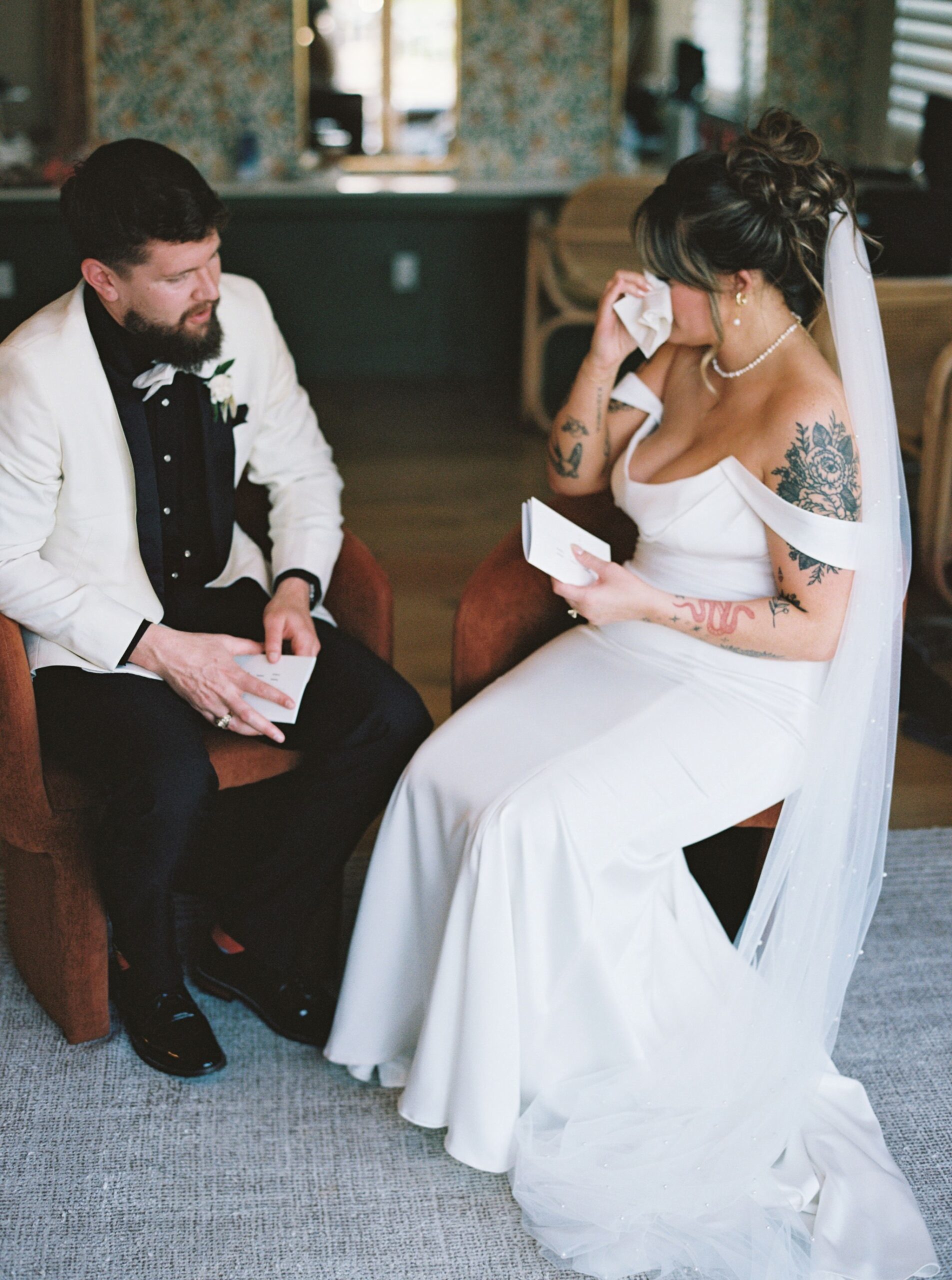 bride wiping tears during a private vow exchange with the groom