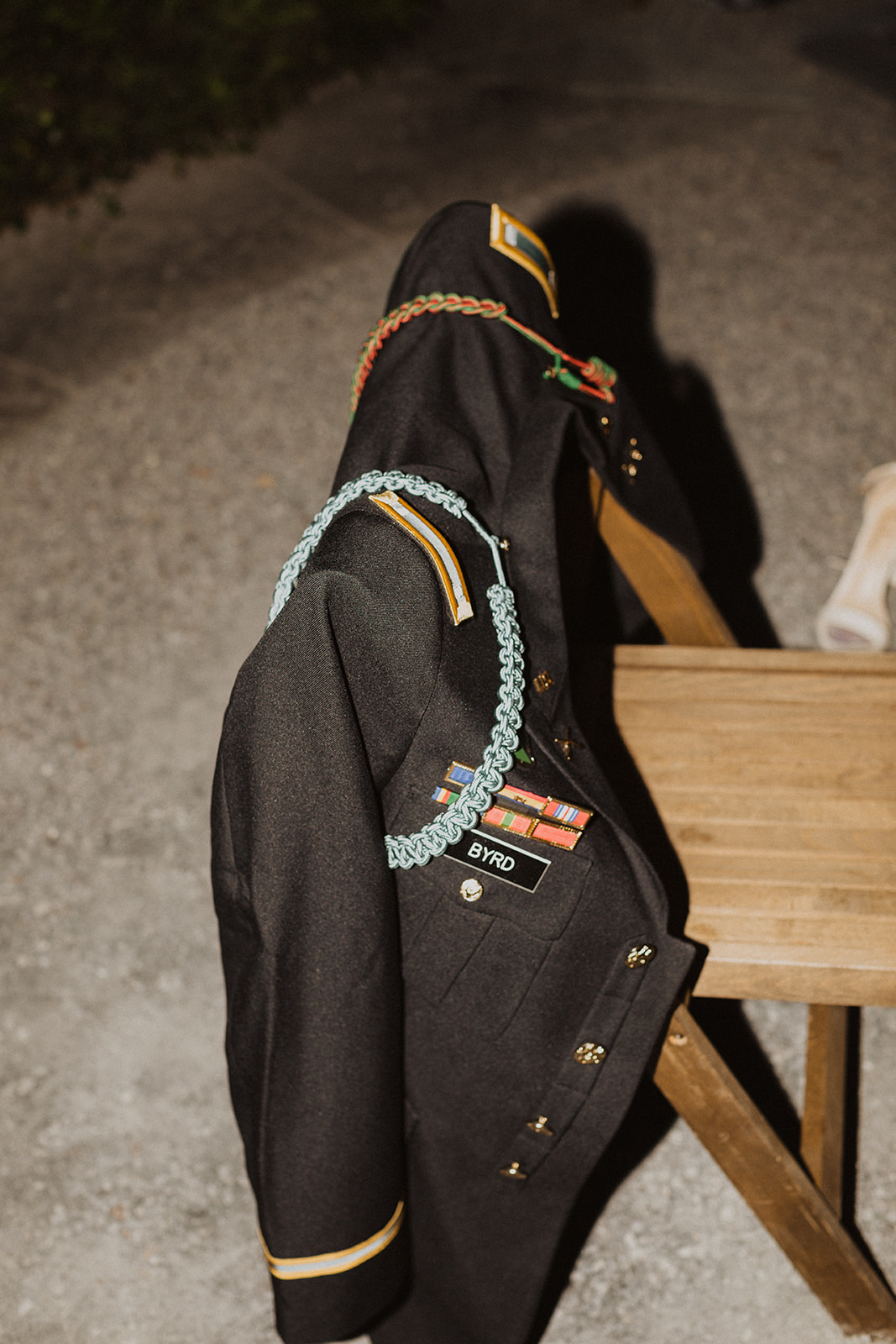 Groom's army officer uniform on chair