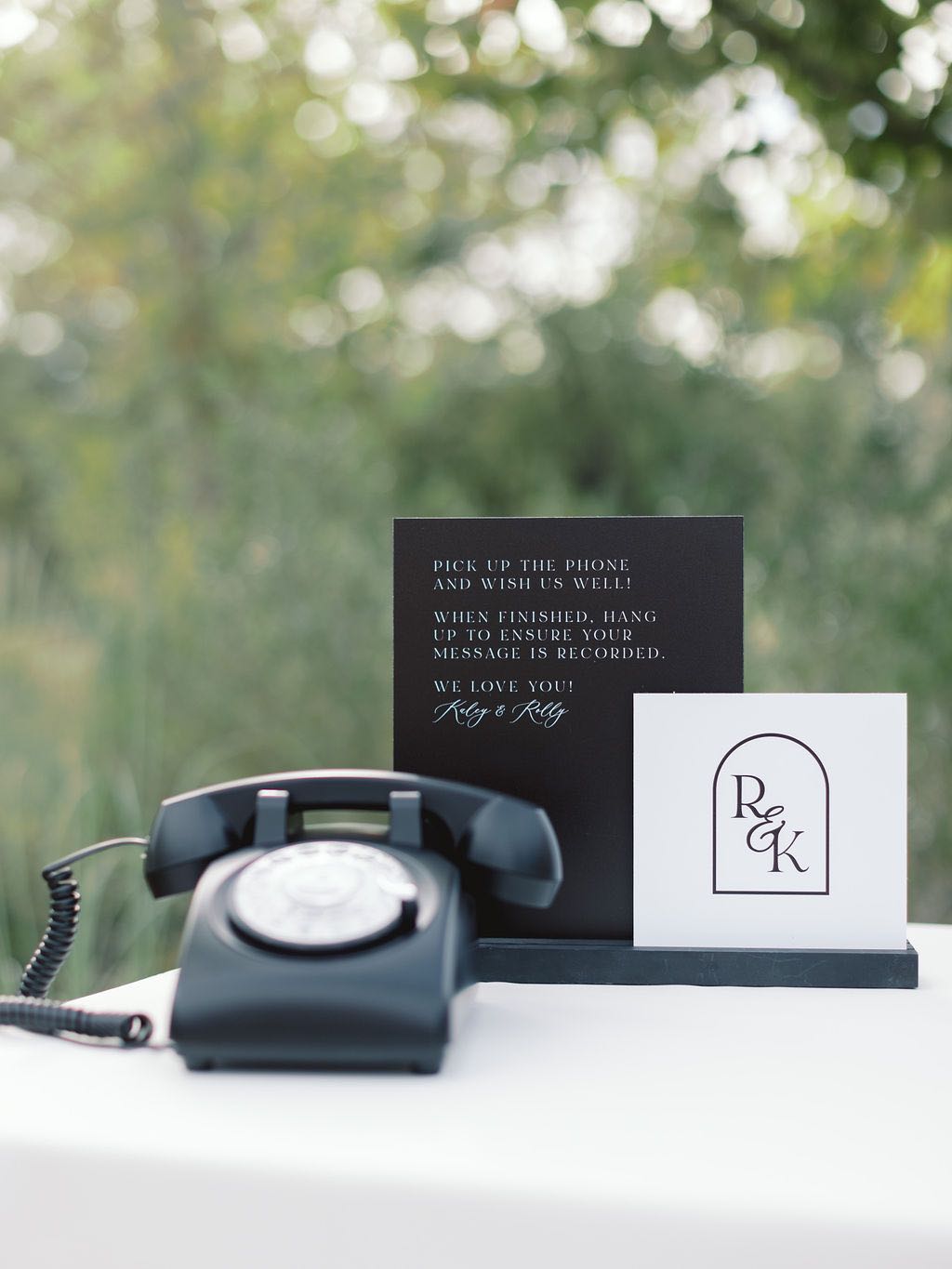 Black and white sign for audio guest book at wedding