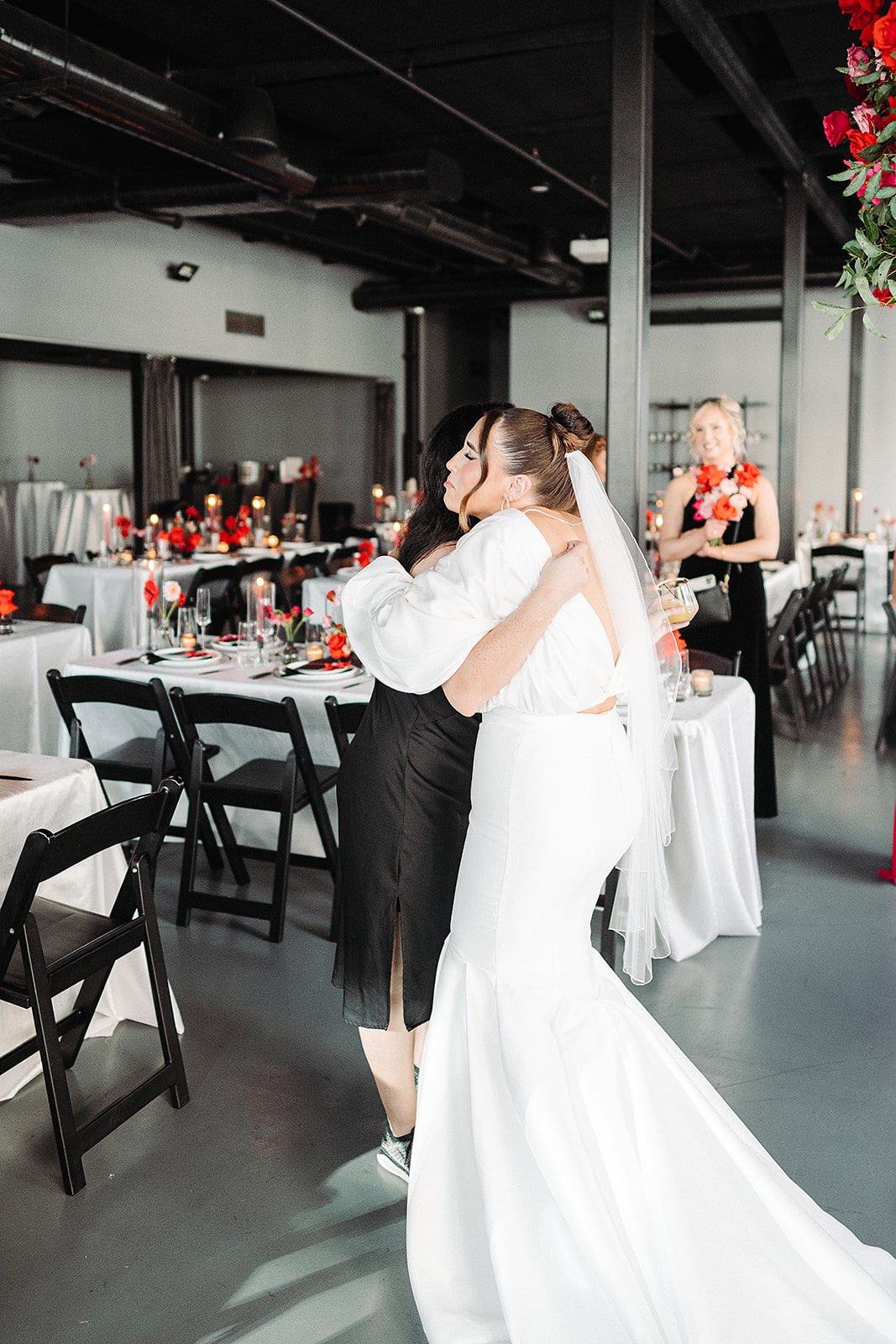 Bride hugs wedding planner, Bianca Nichole and Co after seeing her wedding design come to life