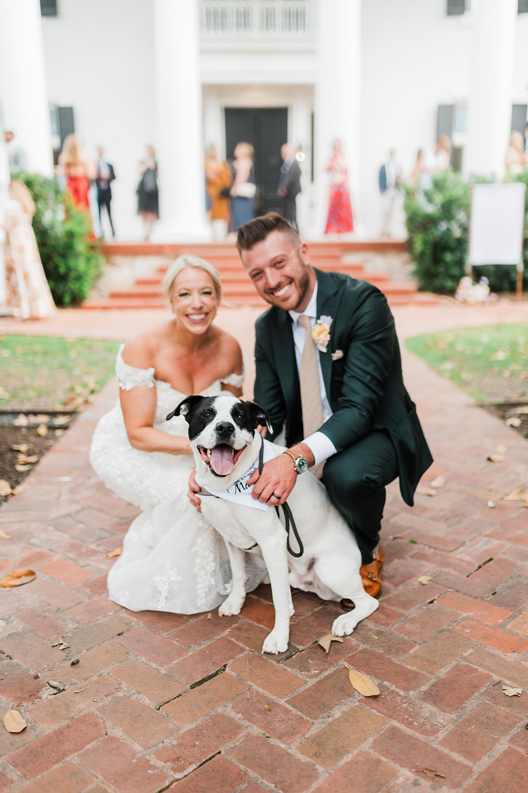 Bride and groom with their pet dog at Woodbine Mansion