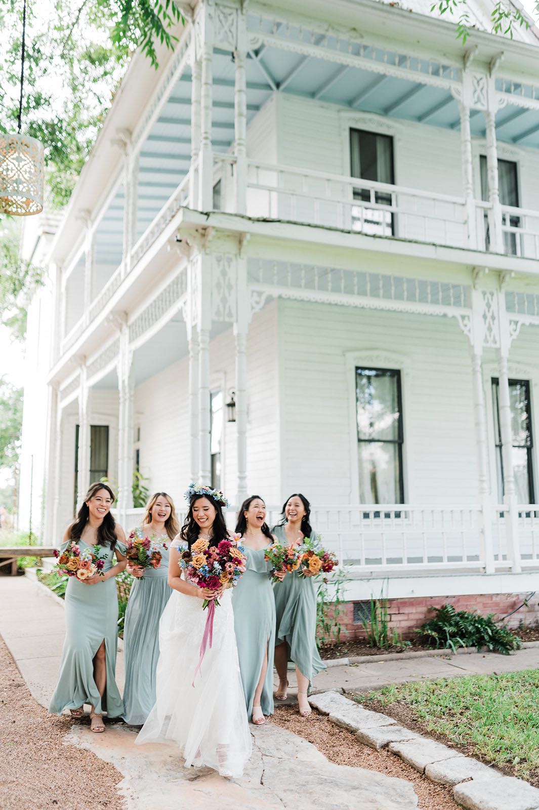 Bride with bridesmaids in sage dresses at barr mansion