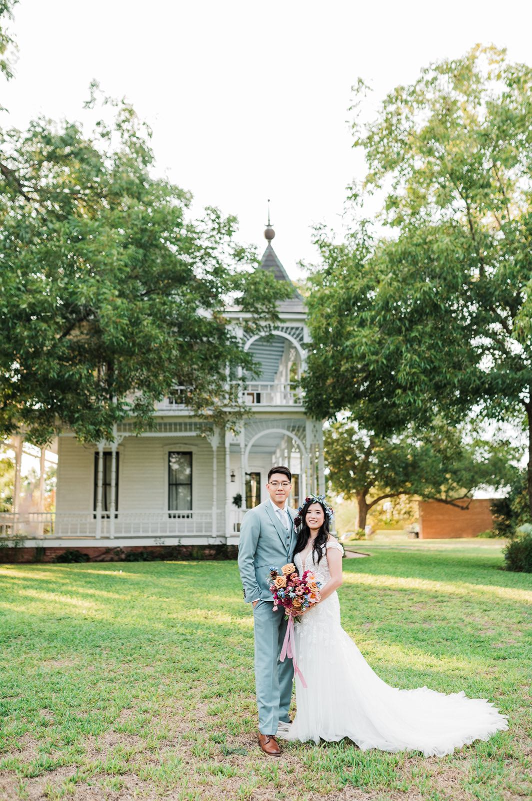Bride and Groom with colorful bouquet at Barr Mansion