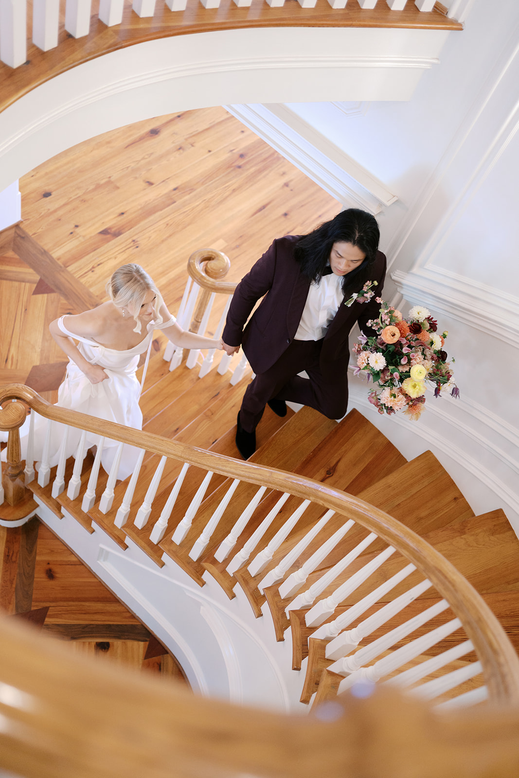 bride-and-groom-walking-up-donovan-manor-staircase