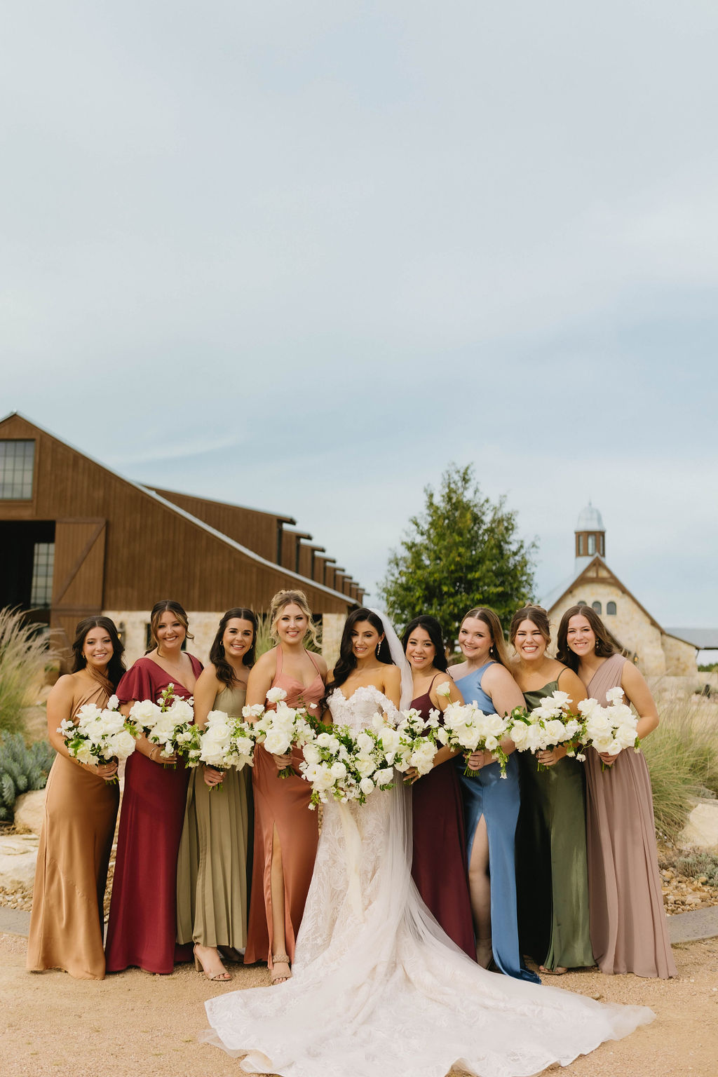 Mismatched bridesmaid dresses in jewel tones