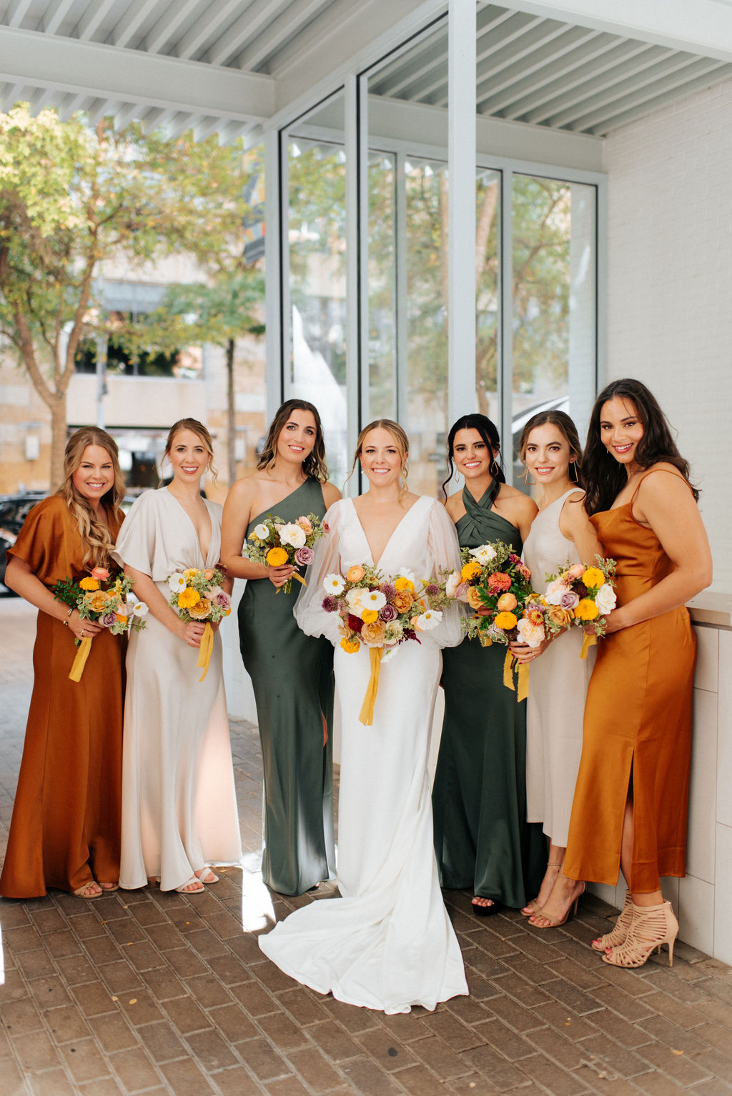 Mismatched bridesmaid dresses in fall colors