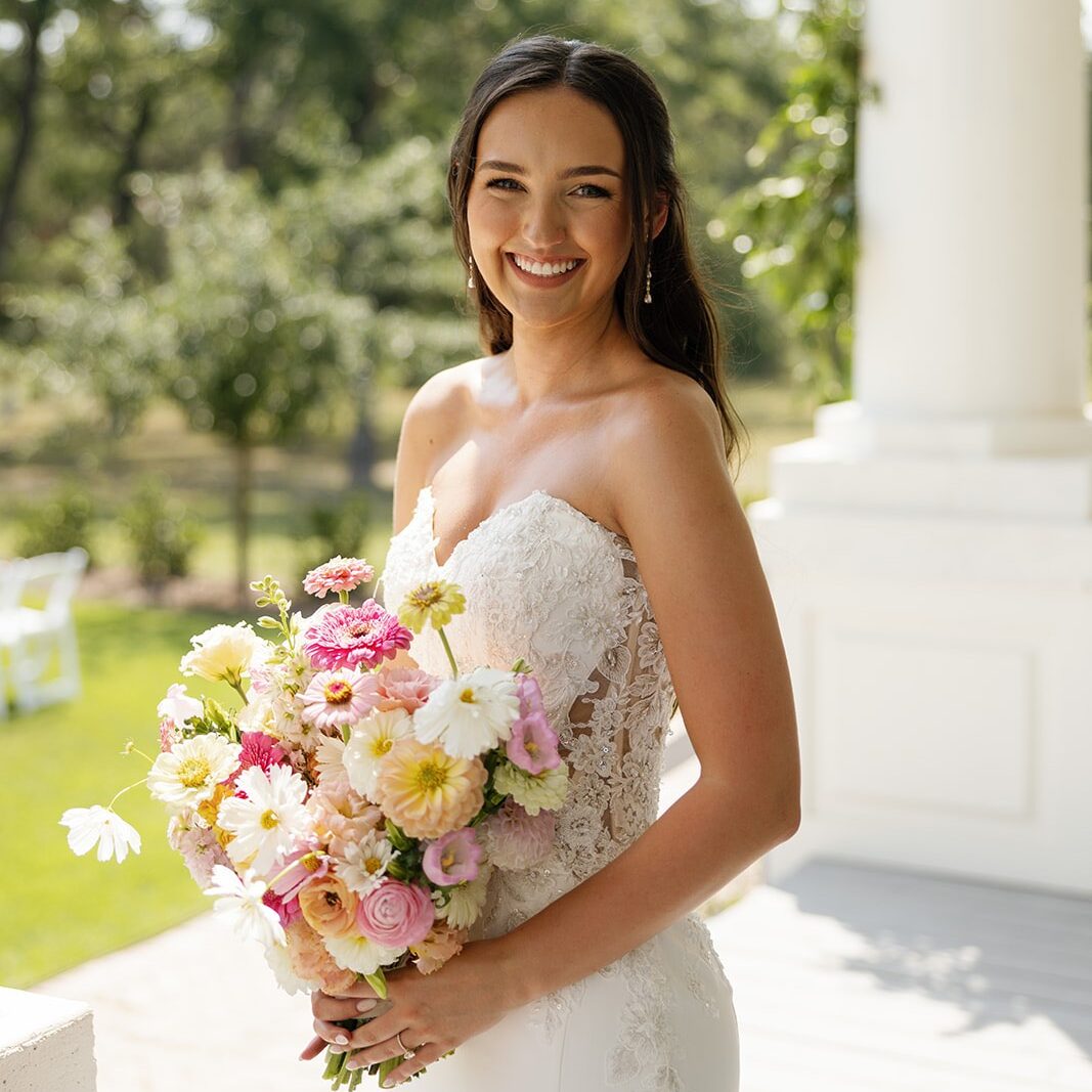 Bride with pink and yellow bouquet