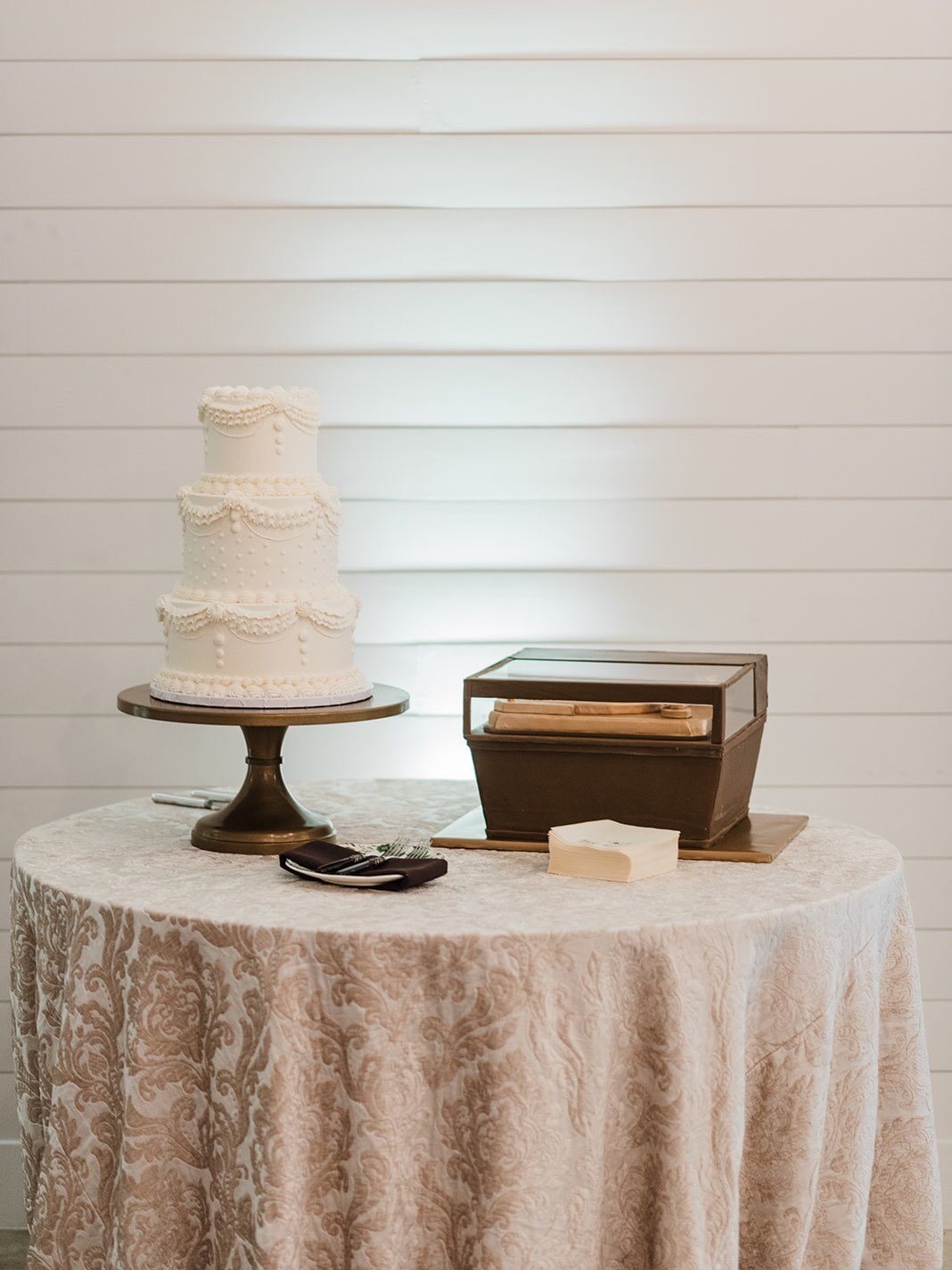 Vintage wedding design with a record player shaped grooms cake and 3-tier ruffled bridal cake