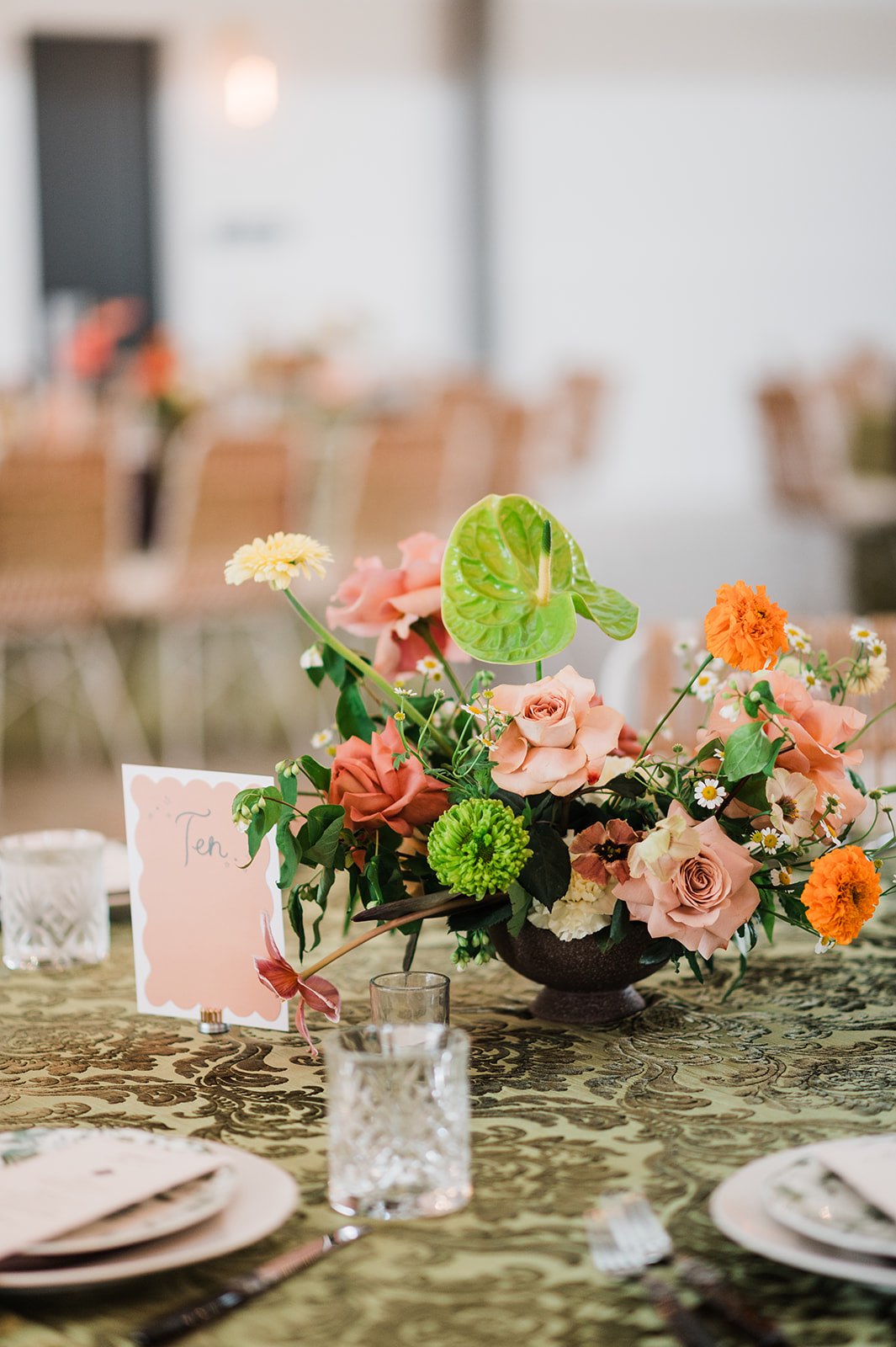 Vintage wedding design with bright flowers and patterned velvet linens