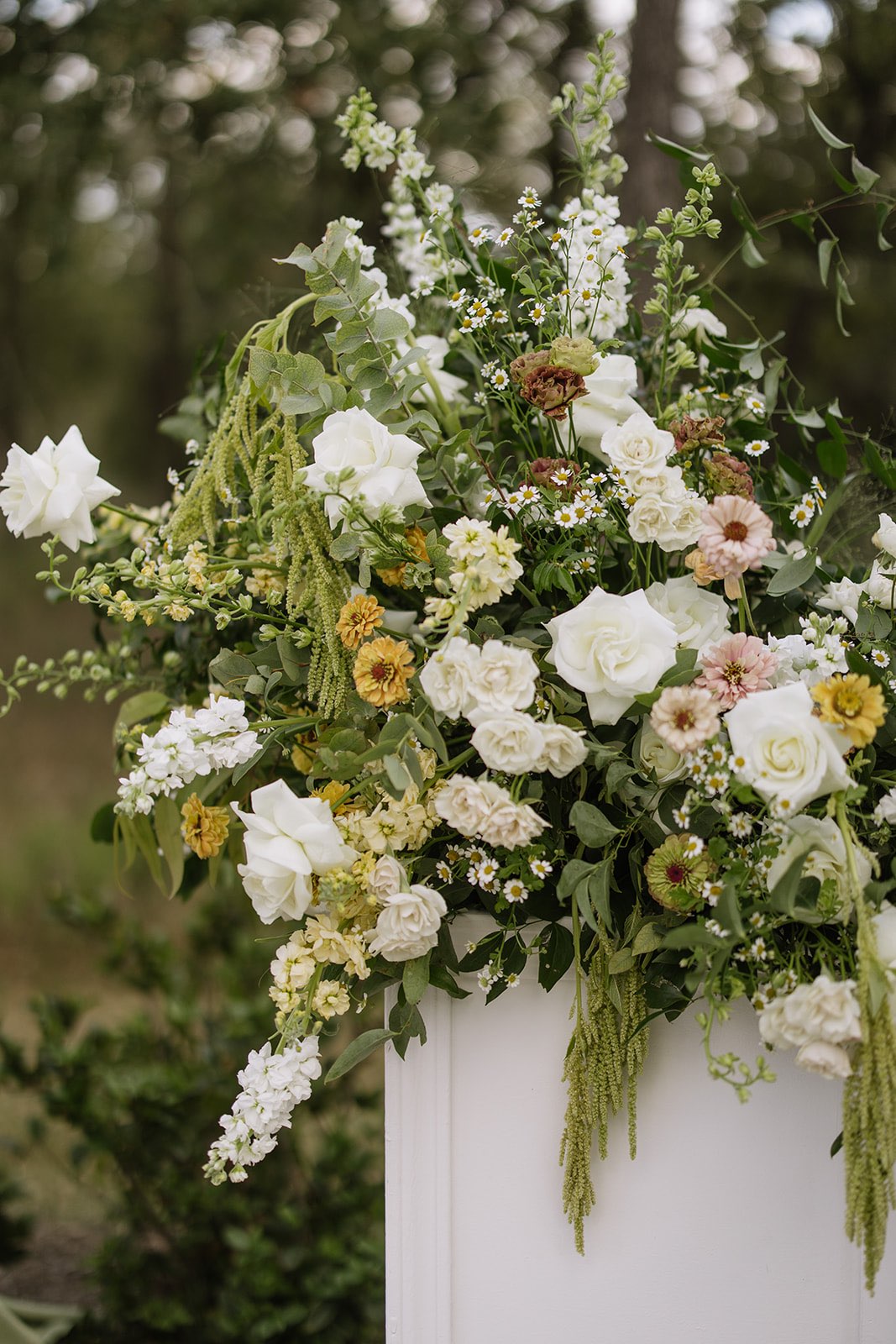 Green, white, yellow and blush wedding ceremony flowers 