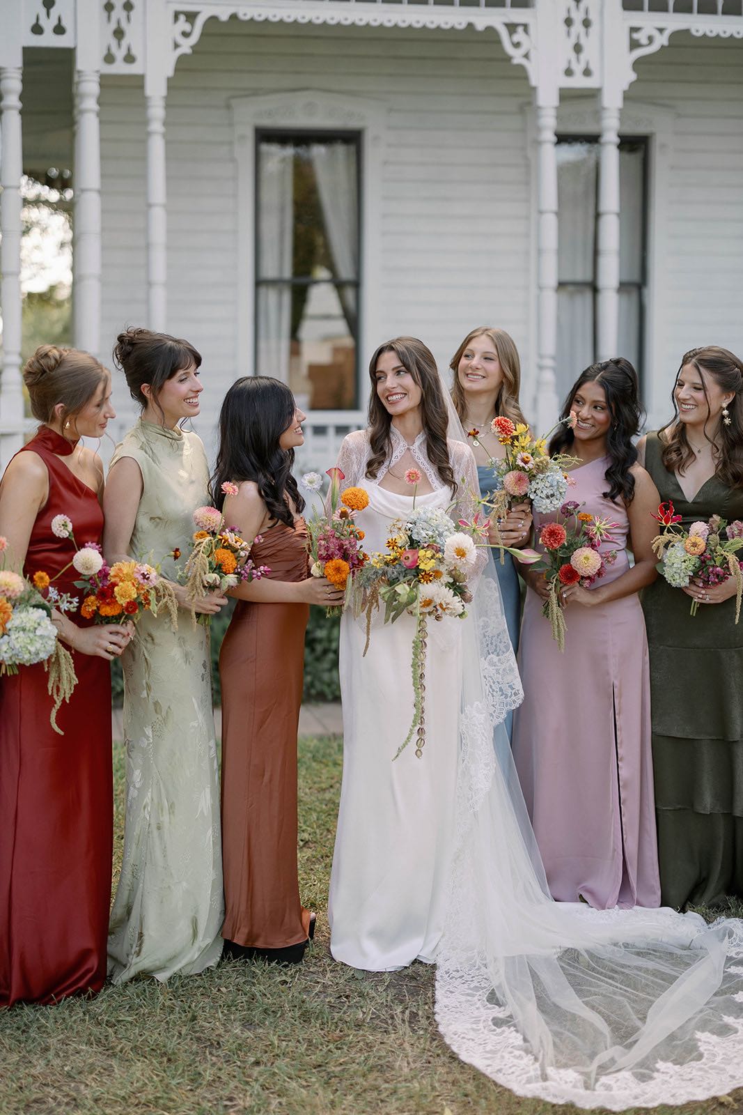 mismatched bridesmaid dresses for colorful garden wedding at barr mansion